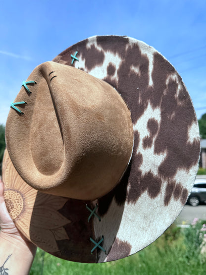 Reverse burned sunflower /cowprint hat with a touch of teal