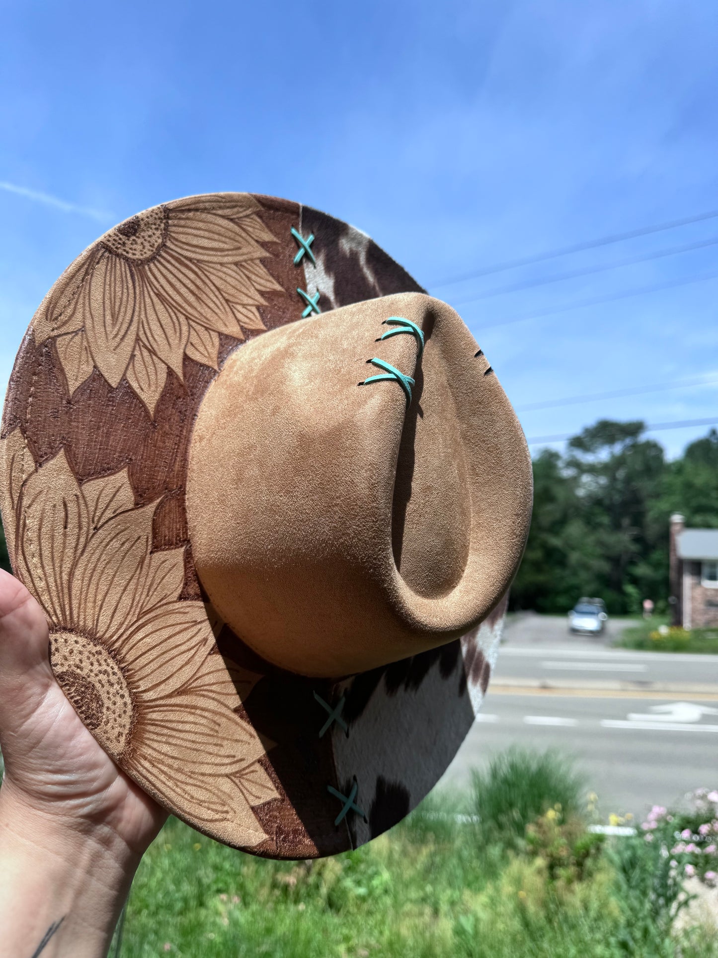 Reverse burned sunflower /cowprint hat with a touch of teal