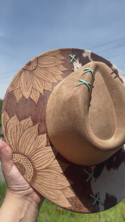 Reverse burned sunflower /cowprint hat with a touch of teal